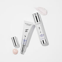 Illuminating AOX Serum and Daily Power Defense on white background
